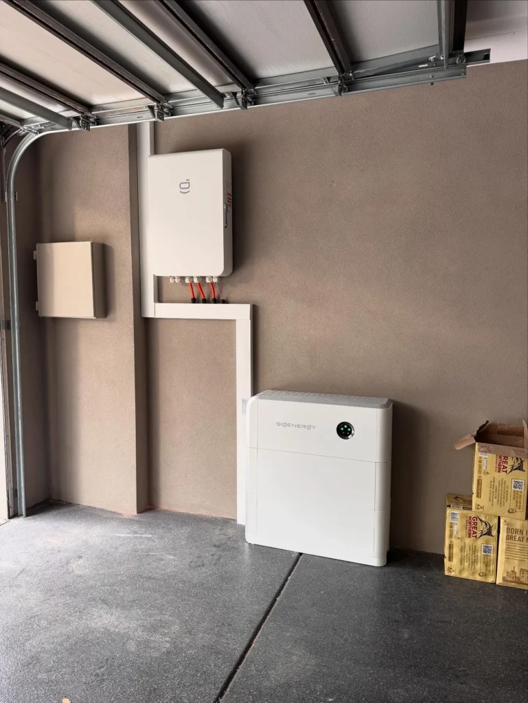 Sigenergy battery and inverter installed on a garage wall by Bolton EC in Perth