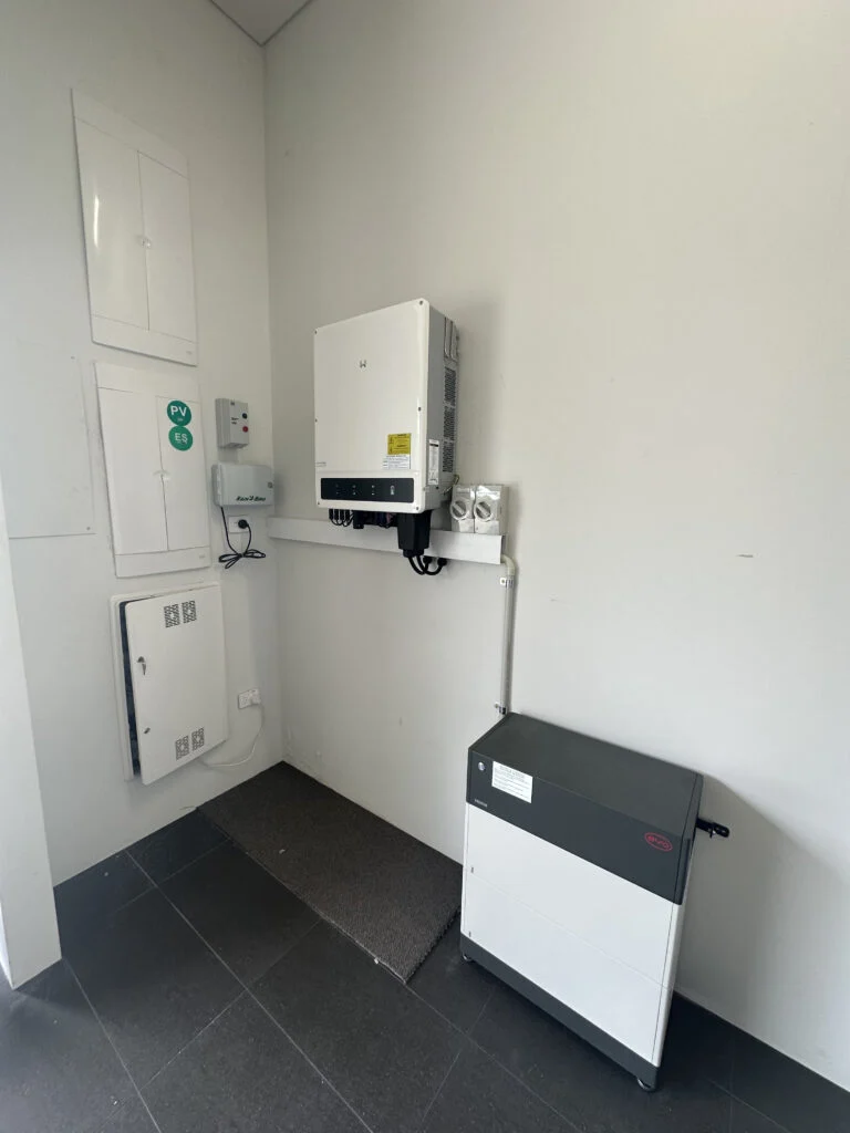 Goodwe hybrid inverter and battery installed in a residential garage