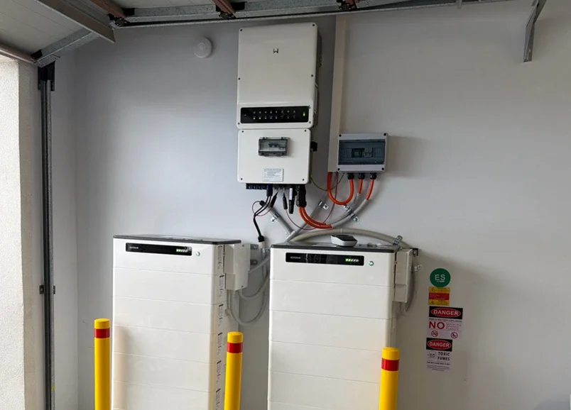 Goodwe inverter and two Goodwe battery units installed in a garage